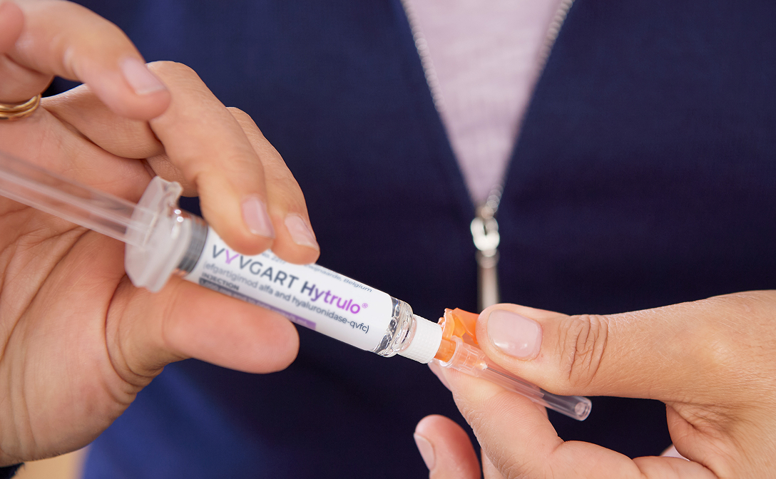 Person holding prefilled syringe