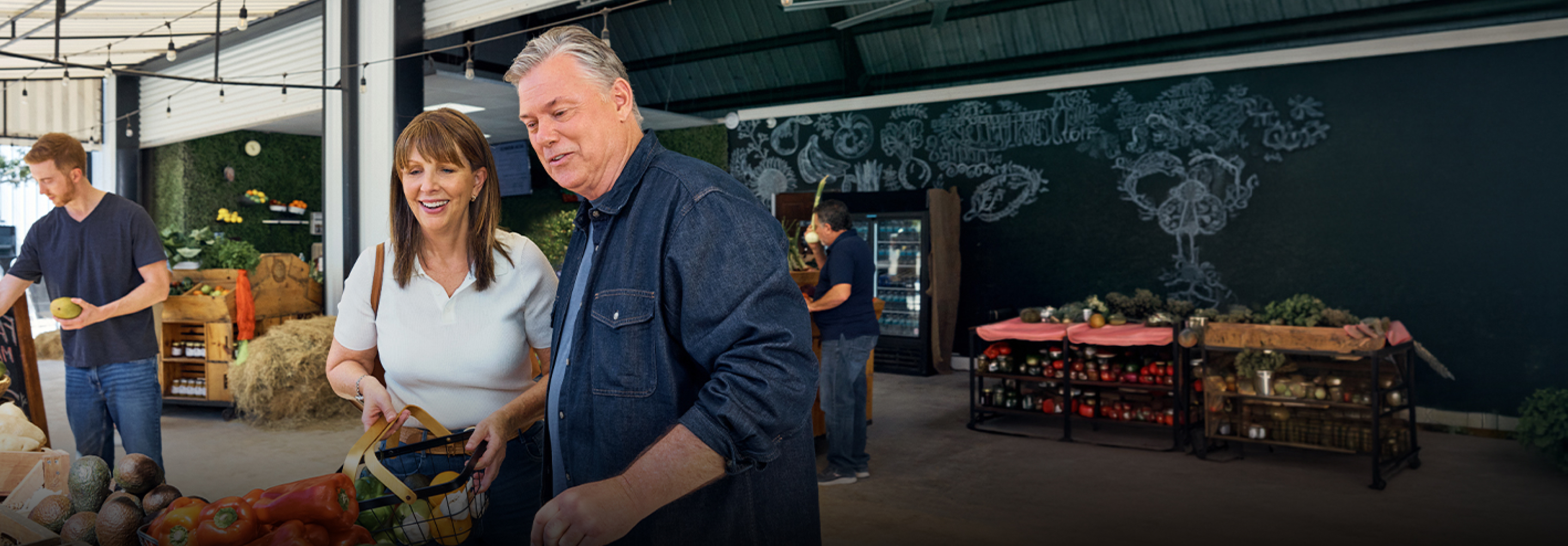 Ken and his family take a selfie in front of a roadside farmstand.