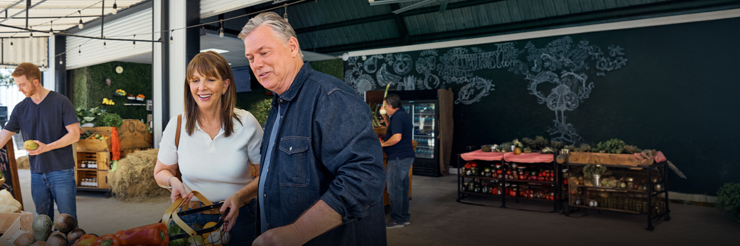 Ken and his family take a selfie in front of a roadside farmstand.
