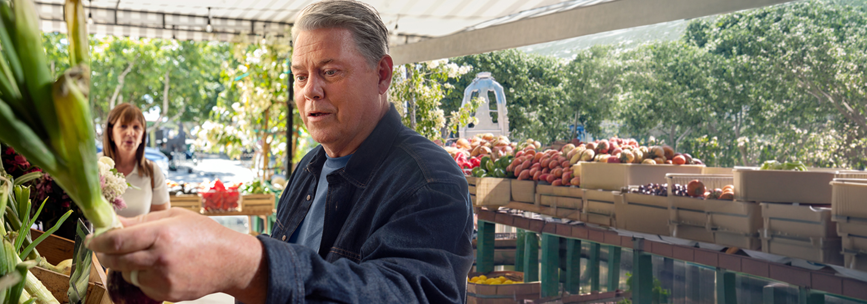 Ken, living with gMG, is visiting a farmers’ market.