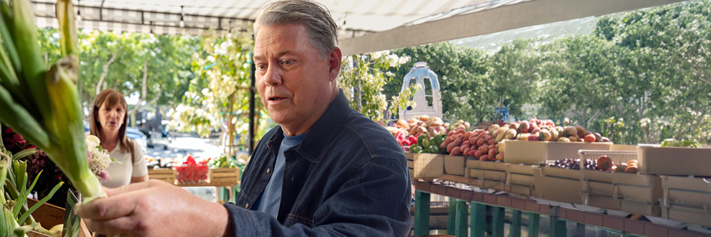 Ken, living with gMG, is visiting a farmers’ market.