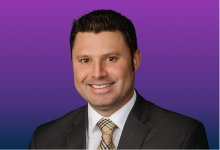 Headshot of Neurologist Jon Durrani against a purple background.
