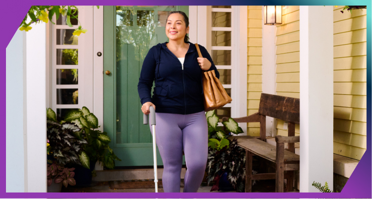 Woman walking outside with cane