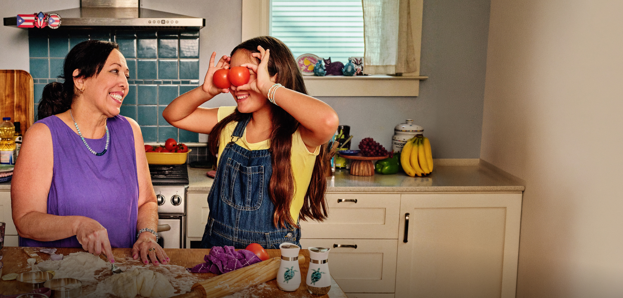 Liz and her granddaughter cooking in the kitchen