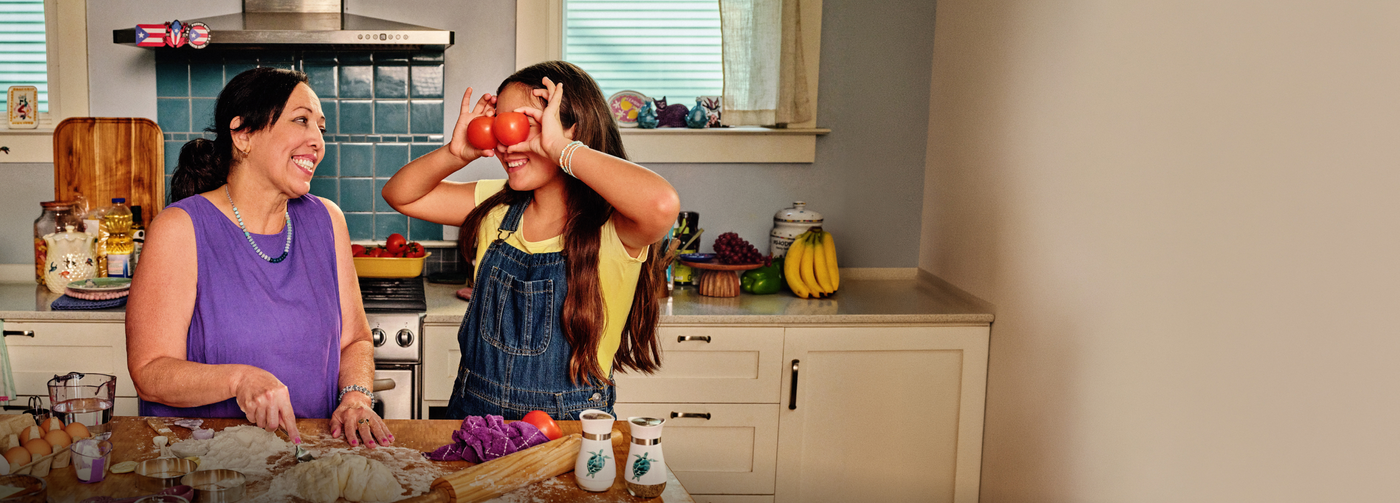 Liz and her granddaughter cooking in the kitchen
